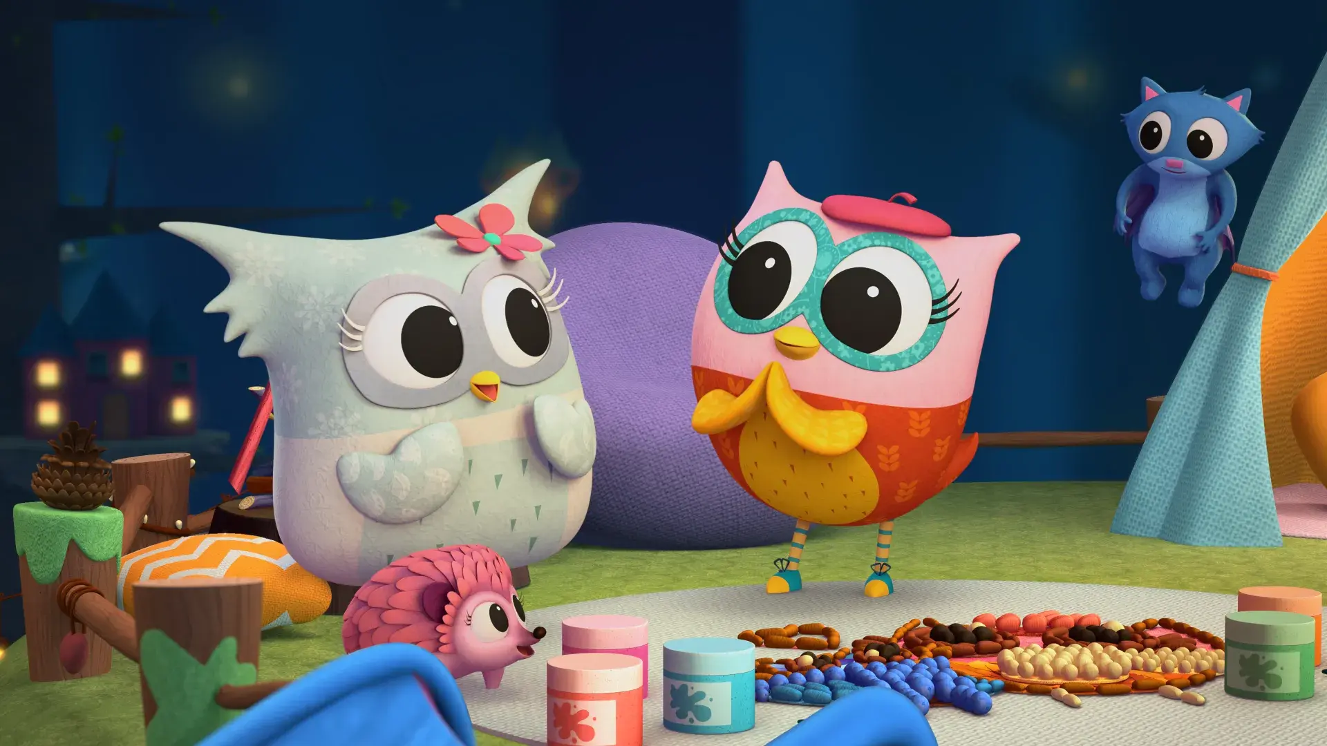 Two owlets looking pleased