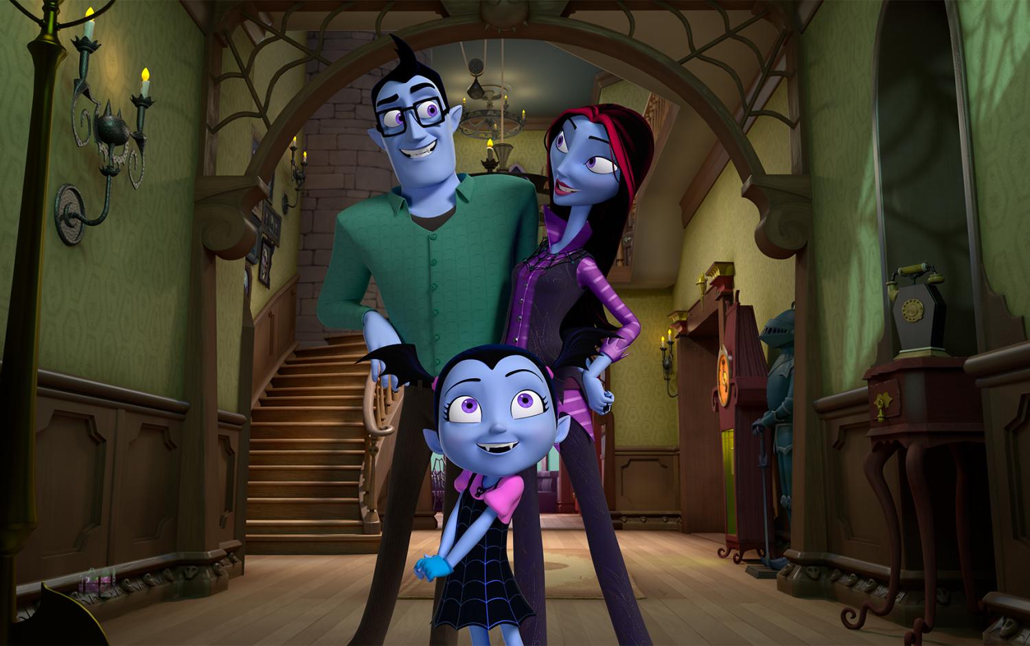Vampirina and her family posed together in the entrance hall of their house