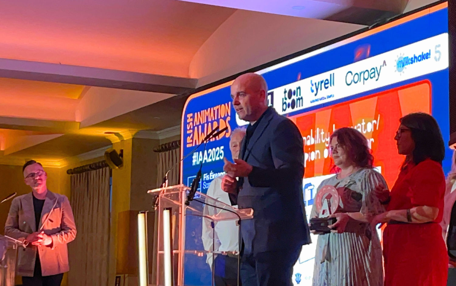 Irish Animation Awards 2025 Awards staff members accepting award on stage