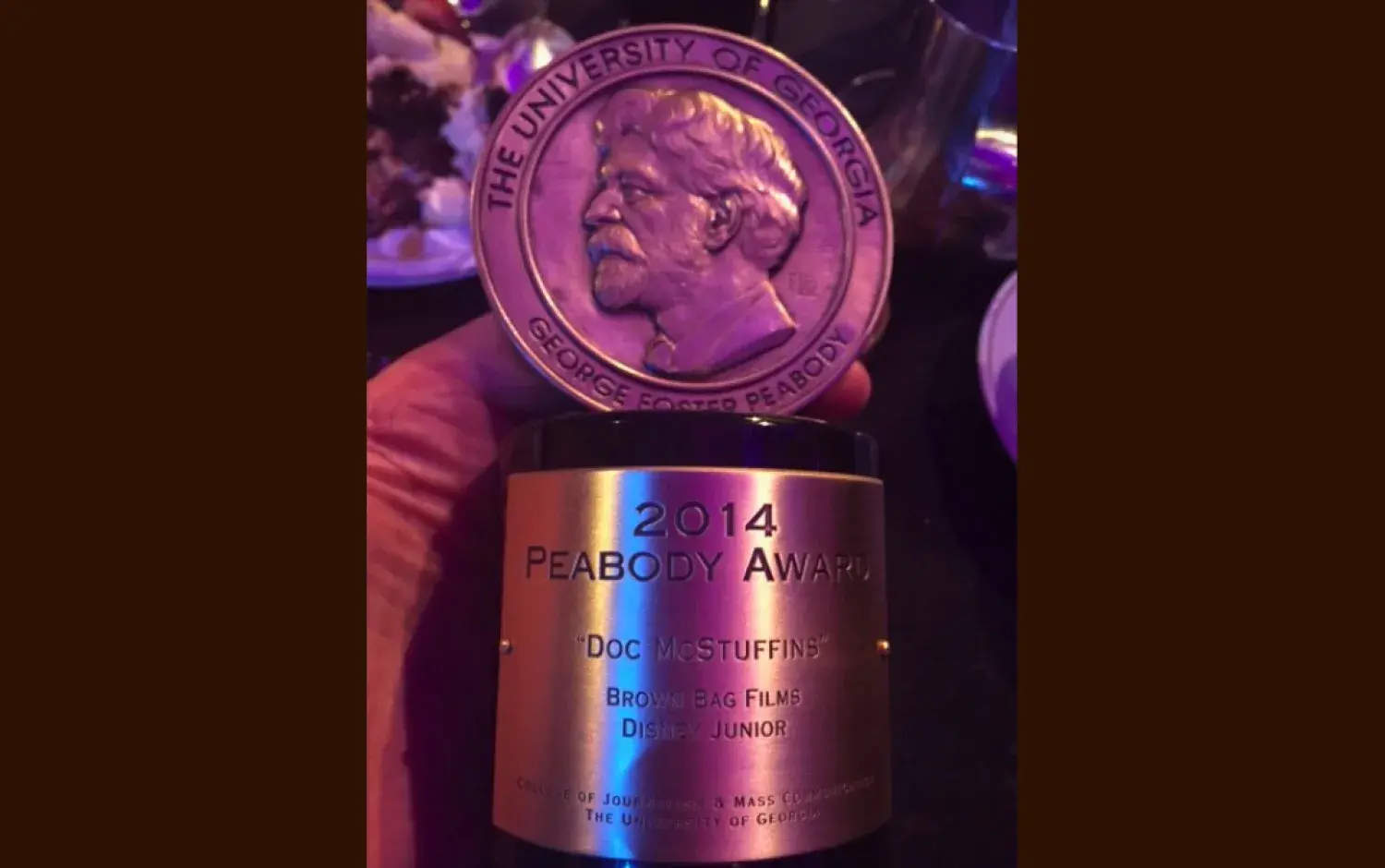 Close-up of a 2014 Peabody Award trophy engraved for “Doc McStuffins.”