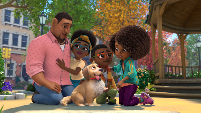 Karma and her family in a group pose. Her dad, Conrad Grant is next to her mom, Lillie Carter-Grant. Her dog, Major, and her brother, Keys, are next to Karma.