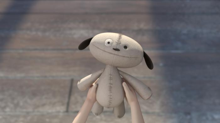 A still from the short film Anya featuring a teddy bear being held out