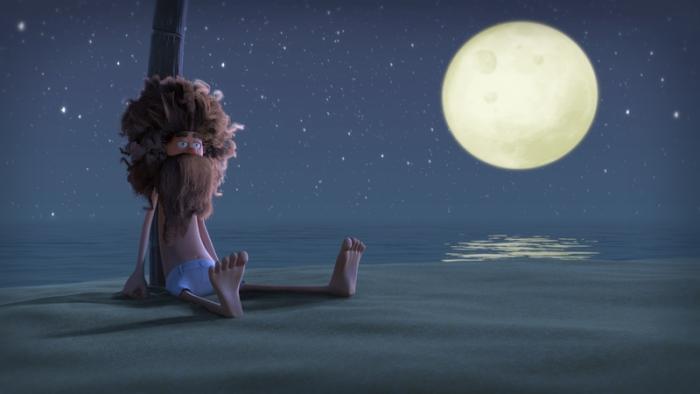 A still from the short film An Ode to Love, showing a man deserted on a beach with a stick