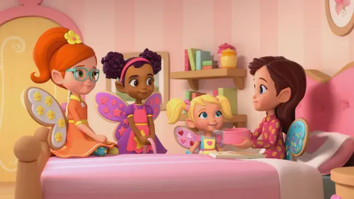 Butterbean in her bedroom sitting up in bed with her friends around her