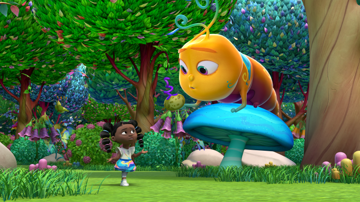 Dee standing near a large caterpillar on top of a blue mushroom