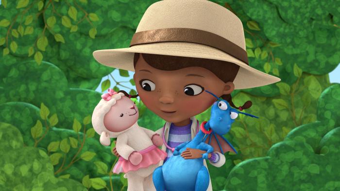 Doc McStuffins holding Lambie and Stuffy.