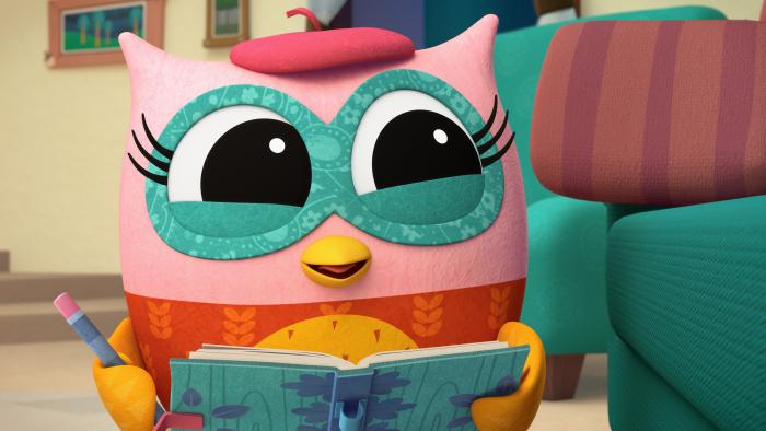 Eva the Owlet holding her journal and pencil
