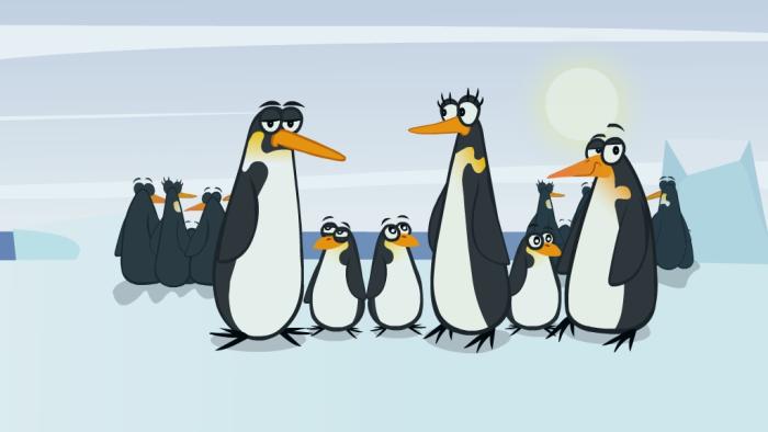 a group of penguins standing together on the ice