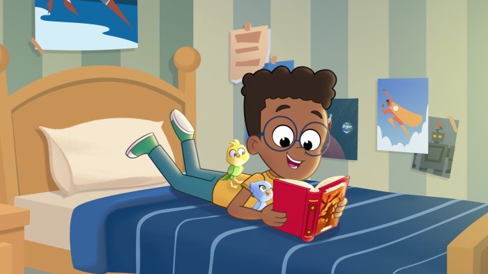 Max reading a book with Ace and Polly