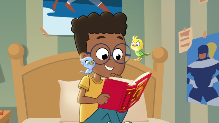 Max reading a book with Ace and Polly